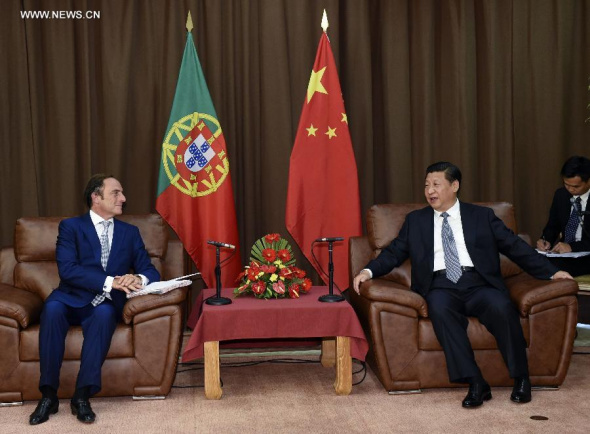 Chinese President Xi Jinping (R) meets with Portuguese President's representative, Deputy Prime Minister Paulo Portas, in Terceira Island, Portugal, July 24, 2014. (Xinhua/Li Xueren)