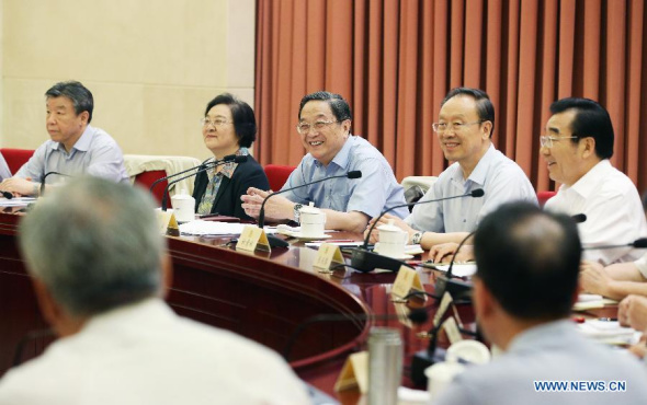 Yu Zhengsheng (C), chairman of the National Committee of the Chinese People's Political Consultative Conference (CPPCC), presides over and addresses a biweekly symposium of the CPPCC in Beijing, capital of China, July 24, 2014. (Xinhua/Yao Dawei)