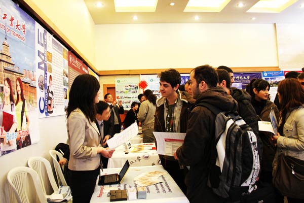 Students inquire about studying in China at an education fair in Ankara, the Turkish capital, in 2012. An increasing number of foreign students are arriving to study in China. Wang Hongjiang / Xinhua