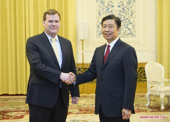 Chinese Vice President Li Yuanchao (R) meets with Canadian Foreign Minister John Baird in Beijing, capital of China, July 30, 2014. (Xinhua/Xie Huanchi)