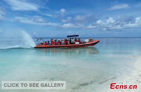 A passage opens at Jinqing Island of Yongle Islands in Sansha city of south China's Hainan province on July 22, 2014. It marks that all inhabited islands in Xisha Islands.[Photo: China News Service / Wang Xiaobin] 
