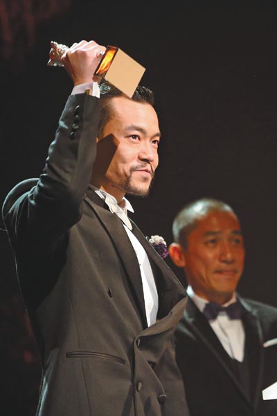 Liao Fan becomes the first Chinese actor to win the Silver Bear for Best Actor for Black Coal, Thin Ice at the 64th Berlin International Film Festival on Saturday. The film also took home the award for best film at the festival. Photo by Zhang Fan / Xinhua
