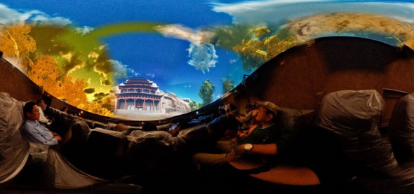 Visitors are amazed at the magnificent scenes shown in the digital film at the new visitor center (below) before entering the Mogao Grottoes in northwestern Chinas Gansu Province.  Peng Pai