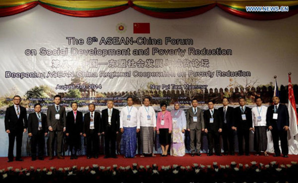 Delegates pose for group photo during the opening ceremony of 8th ASEAN-China Forum on Social Development and Poverty Reduction in Nay Pyi Taw, Myanmar, Aug 7, 2014. (Xinhua/U Aung) 