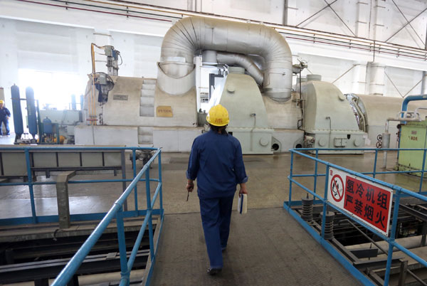 The coal-fired power generators at Beijing's Gaojing Thermal Power Plant are decommissioned on July 23. Provided to China Daily
