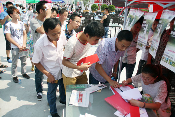 Young men apply for a matchmaking program in Binzhou, Shandong province, on Aug 2. China will continue to experience a gender imbalance with more single men than women. [Guo Zhihua / For China Daily]