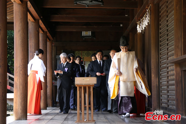 Japan's cabinet officials and lawmakers visit the controversial war-linked Yasukuni Shrine on the 69th anniversary of Japan's surrender in the World War II, Friday, August 15, 2014. [Photo/China News Service]