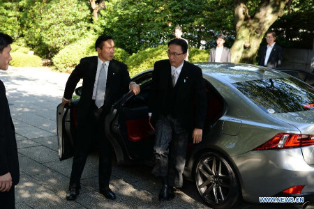Japan's Chairman of the National Public Safety Commission Keiji Furuya (R) arrives to visit the Yasukuni Shrine in Tokyo, Japan, Aug. 15, 2014. Keiji Furuya visited the notorious Yasukuni Shrine on Friday on the 69th anniversary of Japan's surrender in the World War II. (Xinhua/Ma Ping) 