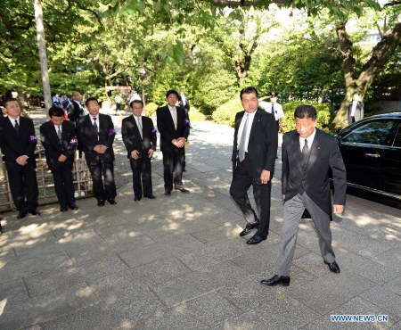Japanese Internal Affairs Minister Yoshitaka Shindo (1st R) arrives to visit the Yasukuni Shrine in Tokyo, Japan, Aug. 15, 2014. Yoshitaka Shindo visited the controversial war-linked Yasukuni Shrine on Friday on the 69th anniversary of Japan's surrender in the World War II. (Xinhua/Ma Ping) 