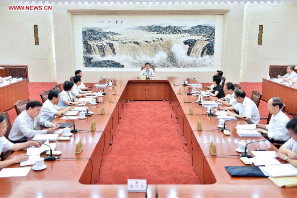 Zhang Dejiang (C), chairman of the Standing Committee of China's National People's Congress (NPC), presides over the 27th meeting of the chairman and vice chairpersons of the 12th NPC Standing Committee at the Great Hall of the People in Beijing, capital of China, Aug 18, 2014. (Xinhua/Li Tao)