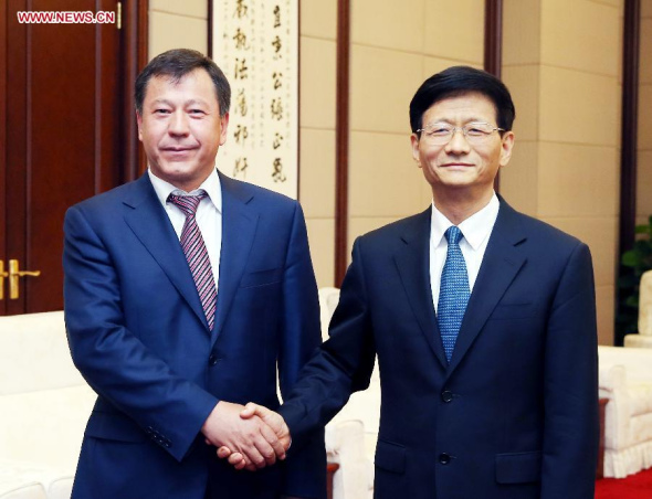 Meng Jianzhu (R), a member of the Political Bureau of the Communist Party of China (CPC) Central Committee and head of the Commission for Political and Legal Affairs of the CPC Central Committee, meets with Minister of Internal Affairs of Tajikistan Rakhimzoda Ramazon Hamro in Beijing, Aug 19, 2014. (Xinhua/Yao Dawei)
