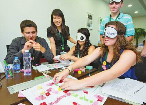 Students from China and the United States find efficient solutions through designing a new Ludo game for the blind. [Provided to China Daily]