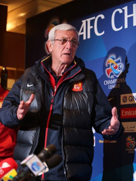 Marcello Lippi stands in the press conference after the match to express his rage and dissatisfaction about the results on Wednesday, August 20,2014. [Photo: gb.cri.cn]