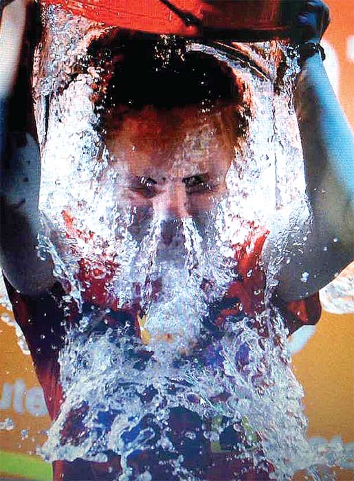At a birthday party for athletes and staff at the Games, several took the ALS ice-bucket challenge. PHOTO BY ZHENG XIN / CHINA DAILY