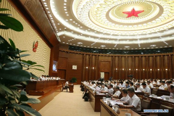 The 10th meeting of China's 12th National People's Congress (NPC) Standing Committee is held in Beijing, China, Aug. 25, 2014. Zhang Dejiang, chairman of the NPC Standing Committee, presided over the meeting. (Xinhua/Liu Weibing)