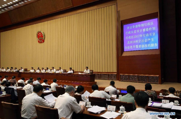 China's lawmakers discuss whether to revise election methods for Hong Kong's chief executive and legislature at the 10th meeting of the 12th National People's Congress (NPC) Standing Committee in Beijing, China, Aug 25, 2014. Zhang Dejiang, chairman of the NPC Standing Committee, presided over the meeting. (Xinhua/Liu Weibing)
