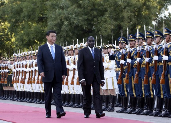 Chinese President Xi Jinping (L front) holds a welcome ceremony for Zimbabwean President Robert Mugabe before their talks in Beijing, China, Aug. 25, 2014. (Xinhua/Ding Lin)
