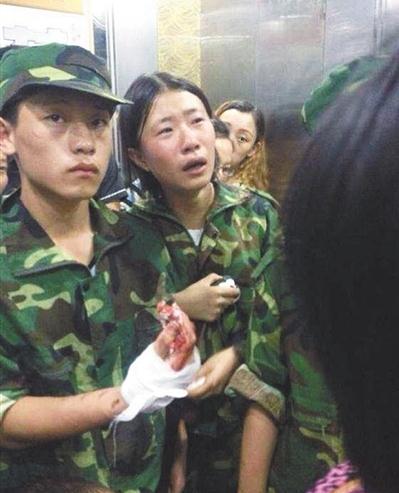 A girl student is crying. A total of 42 people, including 40 students, one teacher and one drillmaster in the incident. (Source: Shanghai Daily) 