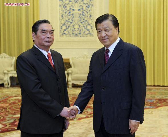 Liu Yunshan (R), a member of the Standing Committee of the Political Bureau of the Communist Party of China (CPC) Central Committee and secretary of the Secretariat of the CPC Central Committee, holds talks with Le Hong Anh, special envoy of General Secretary of the Communist Party of Vietnam(CPV) Central Committee Nguyen Phu Trong, also a Politburo member and standing secretary of the Secretariat of the CPV Central Committee, in Beijing, capital of China, Aug. 27, 2014. (Xinhua/Zhang Duo)