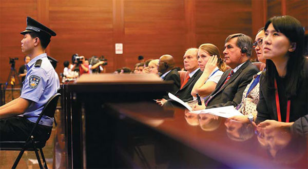 Ambassadors and officials from 20 countries and regions attend a hearing on Wednesday at the Supreme People's Court in Beijing on an intellectual property dispute between a German sanitary appliance firm and a Chinese company. Wang Jing / China Daily