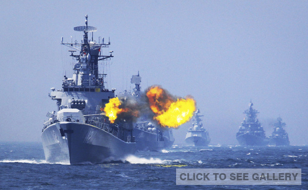 Missile destroyer CNS Harbin conducts live fire exercises during a naval drill this year. Zha Chunming / for China Daily