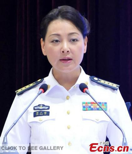 Xing Guangmei, the only spokeswoman for the navy of People's Liberation Army speaks at a press conference held on the navy's No.88 Ship, which is at anchor in Weihai, Shandong province on August 26, 2014. [Photo: China News Service/ Zhang Kai] 