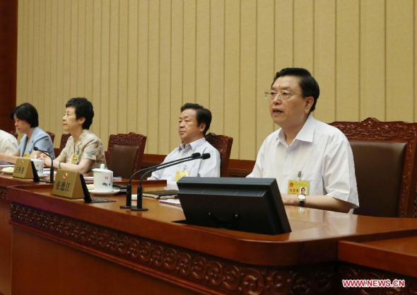 Zhang Dejiang (R), chairman of the Standing Committee of China's National People's Congress (NPC), addresses the closing meeting of the 10th session of the 12th NPC Standing Committee, in Beijing, capital of China, Aug. 31, 2014. (Xinhua/Liu Weibing)