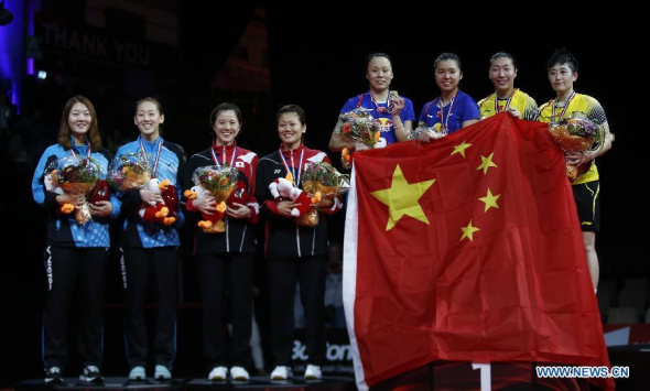 Tian Qing and Zhao Yunlei (4th R) of China celebrate during the awarding ceremony for the Women's Doubles Final on Day 7 of Li Ning BWF World Championships 2014 at Ballerup Super Arena in Copenhagen, Denmark on Aug 31, 2014. Tian and Zhao claimed the championship title by beating their teammates Wang Xiaoli and Yu Yang with 2-0 (21-19, 21-15). (Xinhua/Wang Lili) 
