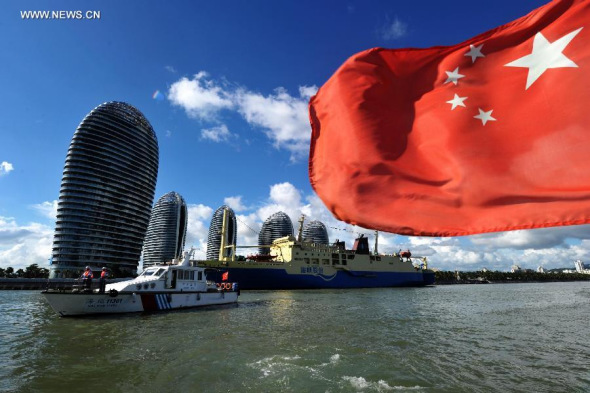 The cruise ship, Coconut Princess, leaves the port of Sanya for the Xisha Islands, in south China's island of Hainan Province, Sept. 2, 2014. The cruise trip between Sanya and Xisha was launched on Tuesday. The ship offers tourists a four-day, three-night cruise on the sea and to Xisha, which boasts more than 40 islets and reefs. (Xinhua/Zhao Yingquan)