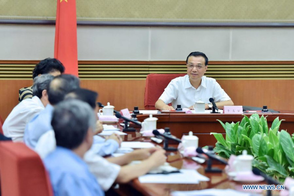 Chinese Premier Li Keqiang presides over a meeting on compiling the 13th five-year plan (2016-2020) for economic and social development, in Beijing, China, Sept 2, 2014. (Xinhua/Li Tao)