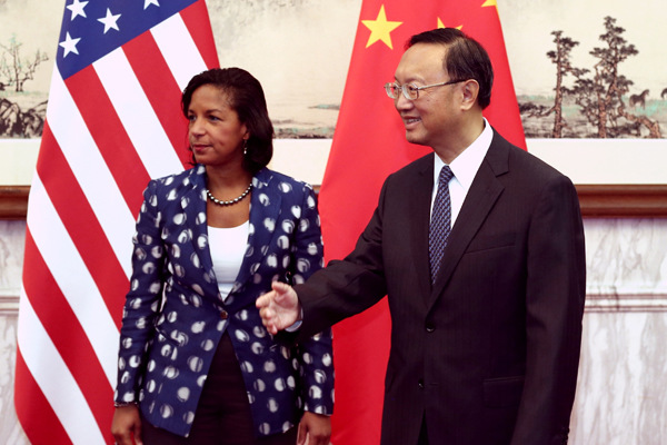 State Councilor Yang Jiechi meets on Monday with US national security adviser Susan Rice, who is paying her first visit to China since she took office in July 2013. [Wang Jing / China Daily]  