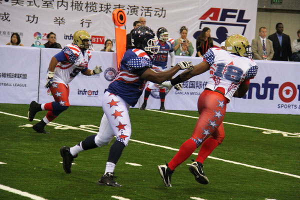 Players from the Arena Football League (AFL) All-Star teams take part in an AFL exhibition game in Beijing at the Beijing Capital Arena on Nov 2, 2013. [Provided to China Daily]