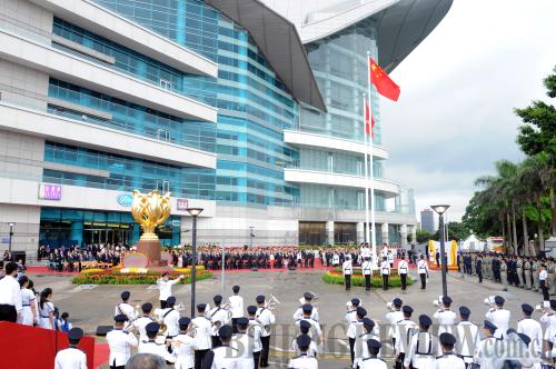 CELEBRATING A NEW ERA: A flag raising ceremony is held at the Golden Bauhinia Square in celebration of the 17th anniversary of Hong Kong's return to China on July 1 (HUANG BENQIANG)
