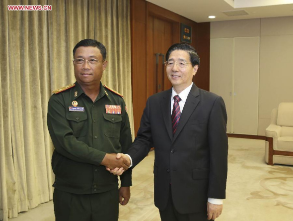 Chinese State Councilor and Minister of Public Security Guo Shengkun (R) meets with Souvone Leuangbounmy, chief of general staff of the Lao People's Army, in Beijing, capital of China, Sept. 11, 2014. (Xinhua/Ding Lin)