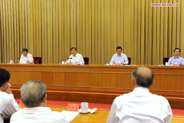 Liu Yunshan (2nd L), a member of the Standing Committee of the Political Bureau of the Communist Party of China (CPC) Central Committee, speaks at a seminar on the Party's mass-line campaign in Beijing, China, Sept. 15, 2014. (Xinhua/Rao Aimin)