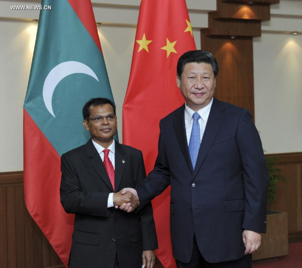 Chinese President Xi Jinping (R) meets with Abdulla Maseeh Mohamed, speaker of the People's Majlis, the unicameral legislative body of Maldives, in Male, Maldives, Sept. 15, 2014. (Xinhua/Zhang Duo)