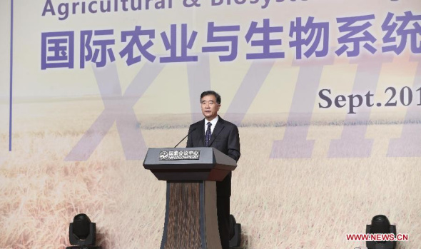 Chinese Vice premier Wang Yang addresses the opening of the 18th World Congress of the International Commission of Agricultural and Biosystems Engineering (CIGR) in Beijing, capital of China, Sept. 16, 2014. (Xinhua/Ding Lin)