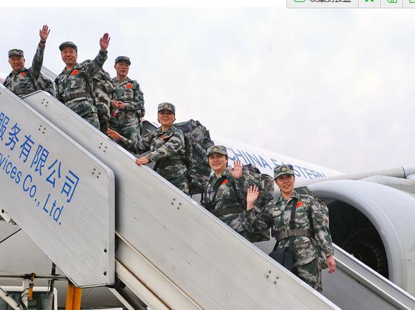 Medical workers wave goodbye in Beijing on Tuesday as they board a plane bound for Sierra Leone. Ma Ruzhuang / for China Daily 