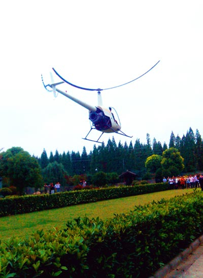 The helicopter built and piloted by an entrepreneur delivers a bride to her wedding venue in Changzhou, Jiangsu province. Wu Kai / China Daily
