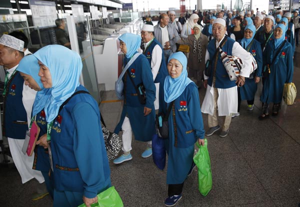 Pilgrims from the Inner Mongolia autonomous region are seen at the Beijing Capital International Airport before heading to the holy city of Mecca in Saudi Arabia for the annual pilgrimage of Muslims. More than 14,500 pilgrims from China made the trip. Liu Guanguan / China News Service  