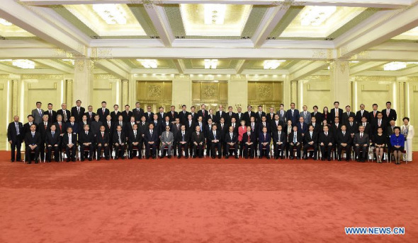 Chinese President Xi Jinping meets with a delegation of Hong Kong's industrial and business circles headed by Tung Chee-hwa in Beijing, capital of China, Sept 22, 2014. (Xinhua/Li Xueren)