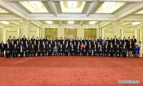 Chinese President Xi Jinping meets with a delegation of Hong Kong's industrial and business circles headed by Tung Chee-hwa in Beijing, capital of China, Sept. 22, 2014. Photo: Xinhua