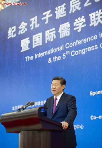 Chinese President Xi Jinping addresses an international seminar to mark the 2,565th anniversary of the birth of Confucius, which is concurrent with the Fifth Congress of the International Confucian Association (ICA), at the Great Hall of the People in Beijing, capital of China, Sept. 24, 2014. (Xinhua/Huang Jingwen)