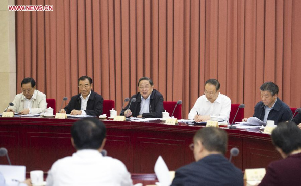 Yu Zhengsheng (C), chairman of the National Committee of the Chinese People's Political Consultative Conference (CPPCC), speaks while presiding over a biweekly symposium of the CPPCC in Beijing, capital of China, Sept 25, 2014. (Xinhua/Xie Huanchi)