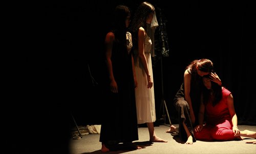 School teacher Xu Jingru (bottom right) performs in the classic drama Anitgone. Photos: Courtesy of Guangzhou Dramatic Arts Center