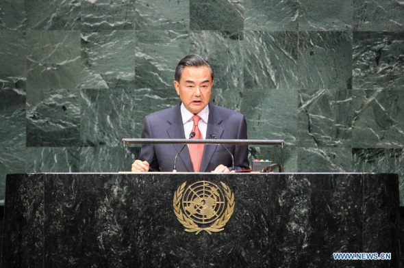 Chinese Foreign Minister Wang Yi speaks during the general debate of the 69th session of the United Nations General Assembly, at the UN headquarters in New York, on Sept. 27, 2014. (Xinhua/Niu Xiaolei)