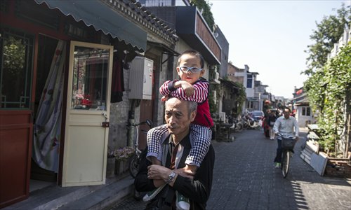 Local residents in one of the hutong in the old Dashilar neighborhood near Tiananmen Square. Photo: Li Hao/GT
