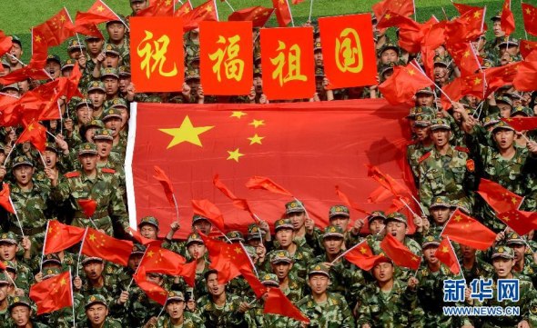 This undated photo shows soldiers celebrate the National Day. (Xinhua Photo)