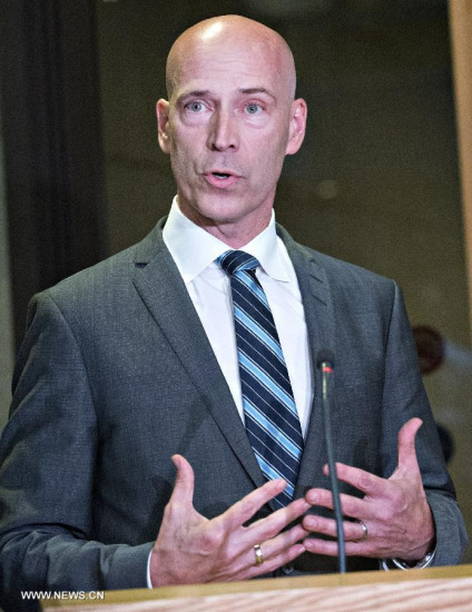 Lin family's lawyer Daniel Urbas addresses media after the first day of the Magnotta trial, in Montreal, Canada, Sept 29, 2014. (Xinhua/Andrew Soong)