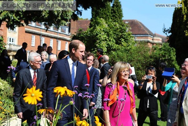 Prince William (L, front), Duke of Cambridge, greets well-wishers with Principal Dame Elise Angioline (R, front) as he arrives to formally inaugurate the Dickson Poon University of Oxford China Centre Building in Oxford, the United Kingdom, on Sept 8, 2014. Prince William unveiled the Dickson Poon University of Oxford China Centre here on Monday. (Xinhua/Han Yan)